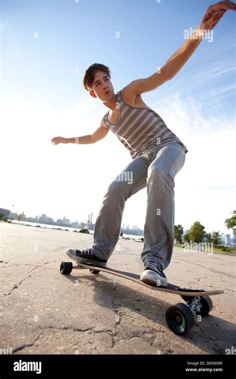 Young Man Skateboarding Stock Photo Alamy