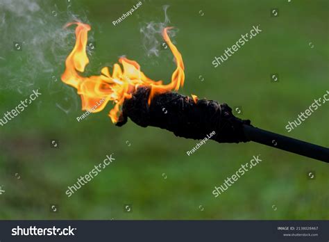 Burning Flame Torch On Green Grass Stock Photo 2138028467 Shutterstock