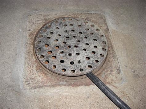 Cutting A Hole In Floor Drain Cover For Drain Hose Plumbing Diy