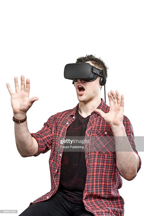 portrait of a man wearing an oculus rift virtual reality headset with news photo getty images