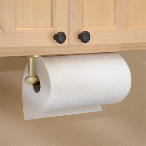 A Roll Of Toilet Paper Is Hanging From The Wall Above A Kitchen Cabinet