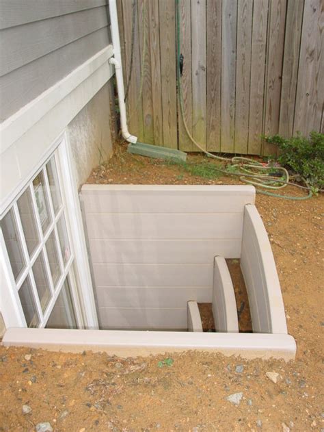 The egress window cover's job is to catch the debris before it tumbles into the bottom of a basement (cellar) window well. Basement Egress | Houzz