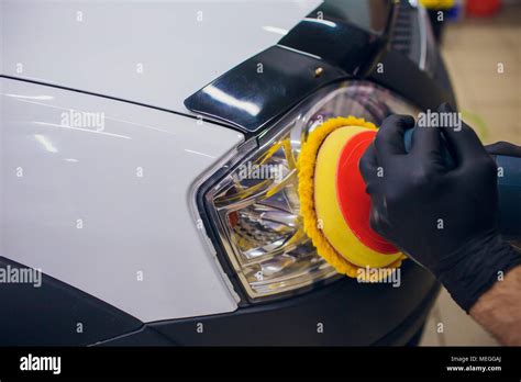 Auto Mechanic Buffing And Polishing Car Headlight Car Detailing Man