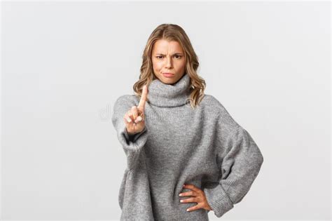 Image Of Serious And Angry Blond Woman Telling To Stop Shaking Finger