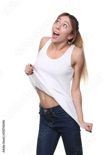 Model Pulling Her Shirt Close Up White Background Stock Photo And