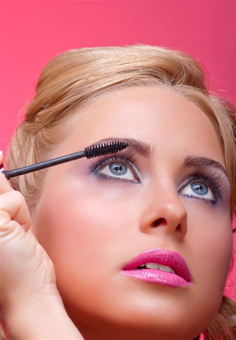 Woman Applying Mascara On Her Eyelashes Stock Photo Image Of Applying