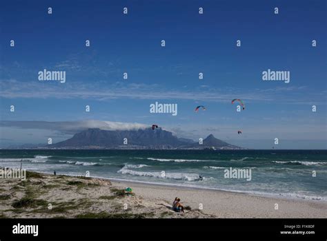 Kite Surfers At Bloubergstrand With Table Mountain The The Background