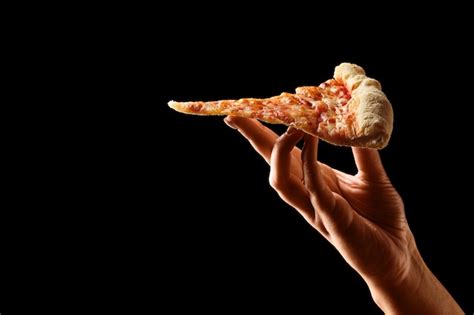 Premium Photo Hand Holding Slice Of Cheese Pizza Cut In Slices