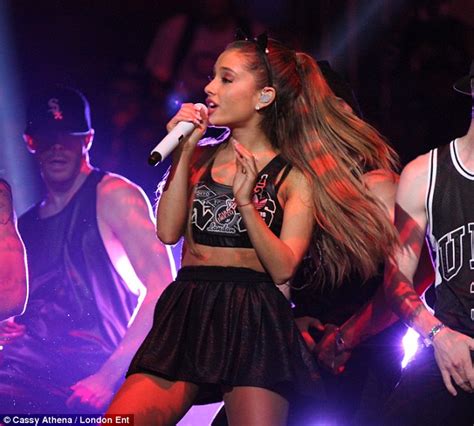 game on ariana grande shows off toned stomach in leather bra and mini skirt during half time