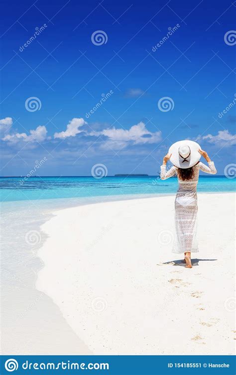 Woman Enjoys The Exotic Landscape On A Tropical Beach Stock Image