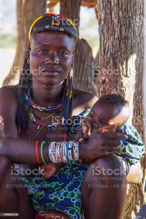 Himba Woman With The Typical Necklace And Hairstyle In Himba Tribe