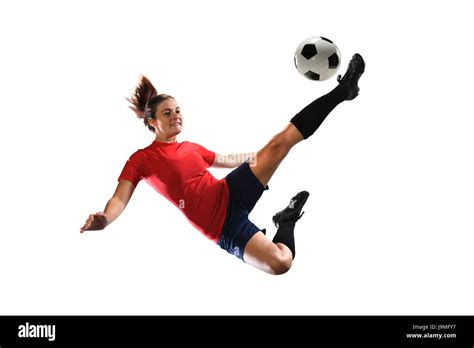 Female Soccer Player Kicking Ball Isolated Over White Background Stock