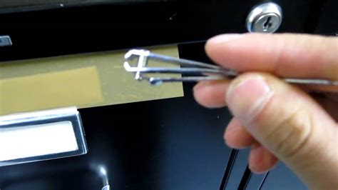 You can use a nail file or a paperclip to get inside. Picking a filing cabinet lock with a nail clipper - YouTube