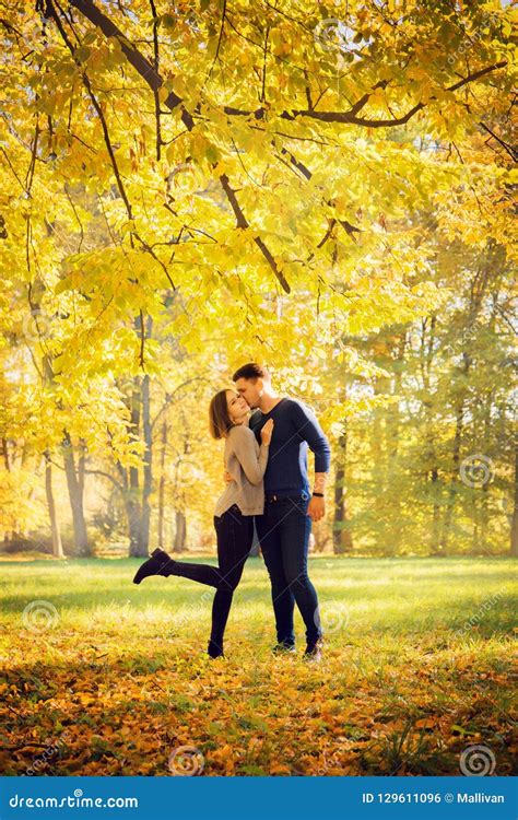 Couple Kissing Under An Autumn Tree Stock Photo Image Of Happiness