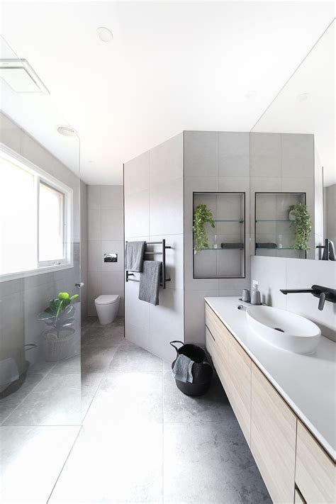A neutral bathroom is better for resale. Neutral tones paired with matte black accessories for this ...