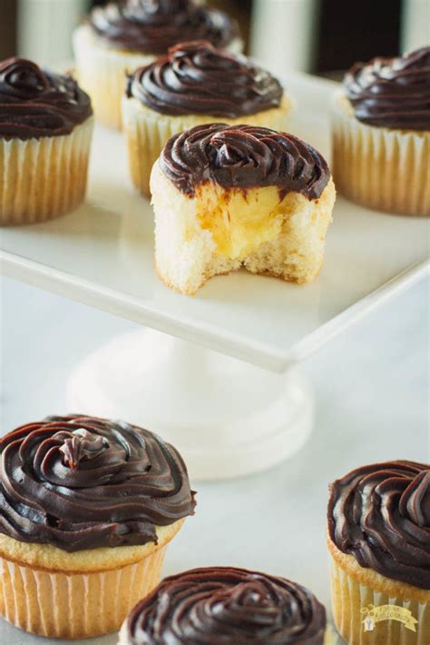 Tender cupcakes filled with fluffy pastry cream and topped with rich chocolate ganache. Boston Cream Pie Cupcakes featuring Durrer Dairy