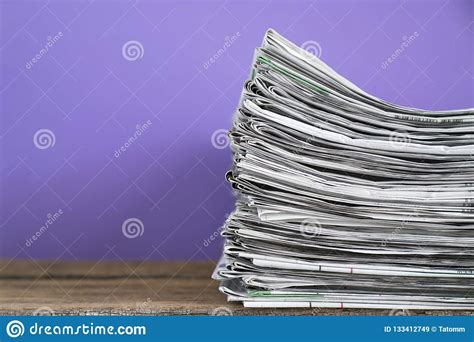 Close Up Newspapers Folded And Stacked Background On The Table Stock