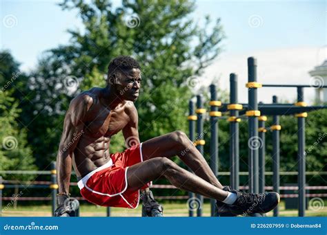 Black Fitness Man Exercising Dips Cross Training Of Male Model In