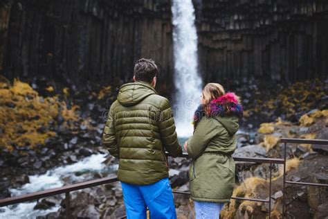 Couple Enjoying View On Waterfall Stock Photo Image Of Portrait Blue