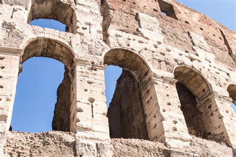 Part Of The Colosseum In Rome With Some Arches In Detail Stock Photo