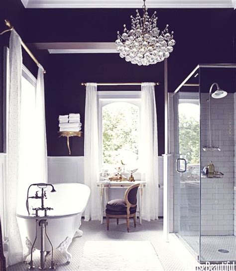 A purple cushioned stool sits next to the shower and tub combo enclosed in a frameless panel. Dreams in HD: Interiors :: Black & White Bathroom Inspiration
