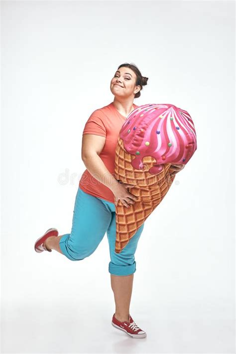 Brunette Chubby Woman Is Holding A Huge Ice Cream Stock Photo Image