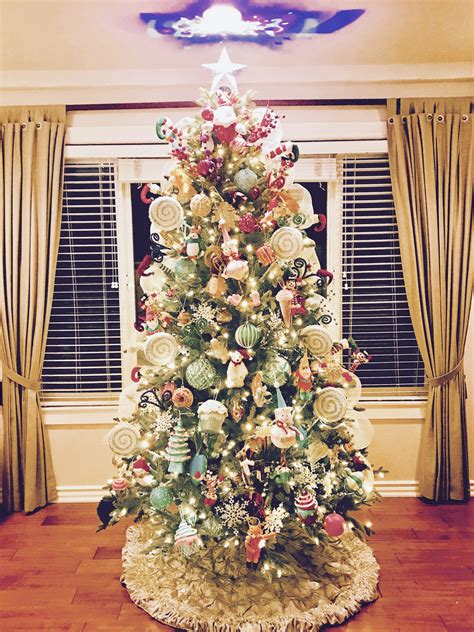 A Decorated Christmas Tree In A Living Room