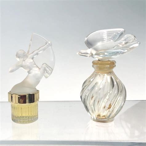 Lot A Collection Of Twenty Four Lalique Miniature Perfume Bottles