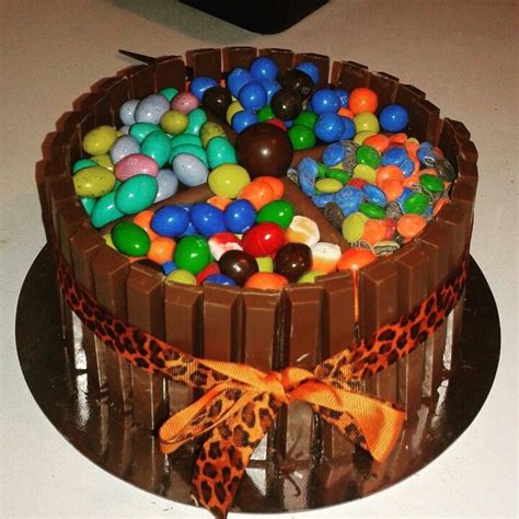 Layer again with lady fingers. M&M Kit Kat Cake with Orange Kit Kats, a Confetti Angel ...