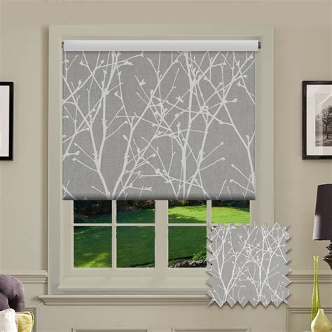 A Patterned Roller Blind In Grey With White Tree Fabric Design This