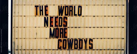 The World Needs More Cowboys Billboard Del Colaborador De Stocksy