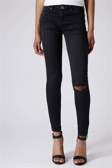 Topshop Moto Ripped Low Rise Leigh Jeans In Black Lyst