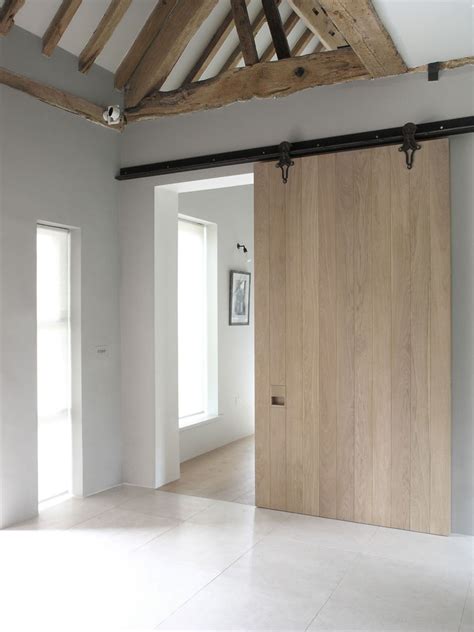 10 Examples Of Barn Doors In Contemporary Kitchens Bedrooms And Bathrooms