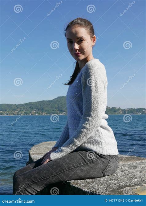 Beautiful Young Woman Relaxing Close To The Lake Lake Stock Image