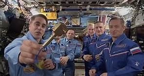 NASA's Chris Cassidy gives space station 'key' to Russia's Sergey Ryzhikov