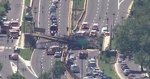 Pedestrian bridge collapses onto DC highway, injuring several