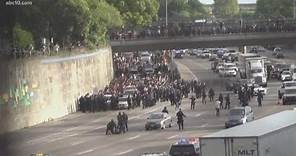 Protesters shut down I-5 in downtown Sacramento as they make their way to the freeway