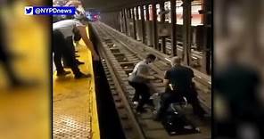 Dramatic video shows NYPD officer jump onto tracks to save man's life