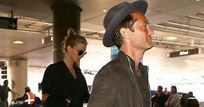 Jude Law And GF Phillipa Coan Arrive At LAX With The Top Down