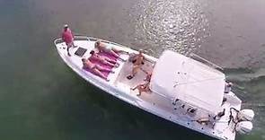 Girl flashes drone on boat
