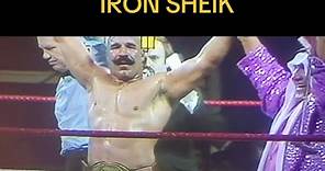 December 1983.The Iron Sheik achieves his greatest triumph, defeating Bob Backlund for the WWF Title in Madison Square Garden. Backlund came onto the match with a bad back from a prior attack by Sheik. This played into the match as Sheik would eventually get Backlund in the dreaded camel clutch submission. Backlund's manager, Arnold Skaalund, would then throw in the towel in a controversial move, which acted as a submission for Backlund. Backlund had previously reigned for six years as world cha