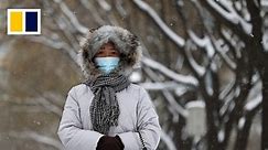 ‘It’s warmer in the fridge’: sub-zero Beijing breaks December cold weather record