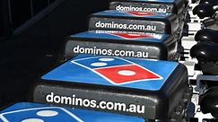 Domino's pizza interim profit slumps