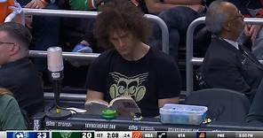 Robin Lopez reads a book in Bucks crowd after they traded him earlier in the day 😂
