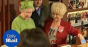Barbara Windsor shows The Queen around the set of EastEnders in 2001