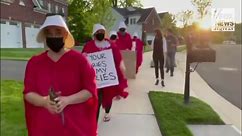 Handmaid Protestors say Justice Amy Coney Barrett does not understand what it is like to bring a child to term as an adoptive mother