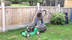 Girl trying to start Petrol Lawn Mower