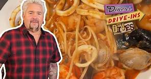 Guy Fieri Eats the "Seafood Buffet for 90" in Baltimore | Diners, Drive-Ins and Dives | Food Network