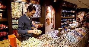 Roger Federer is visiting the new Lindt Shop in his hometown Basel during a break