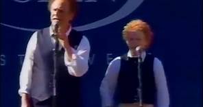 Art Garfunkel and James Garfunkel singing at the US Open tennis tournament 2002